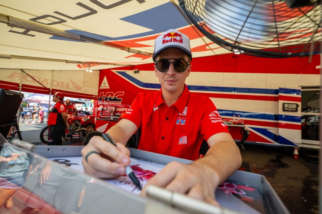 Rider signing autographs 