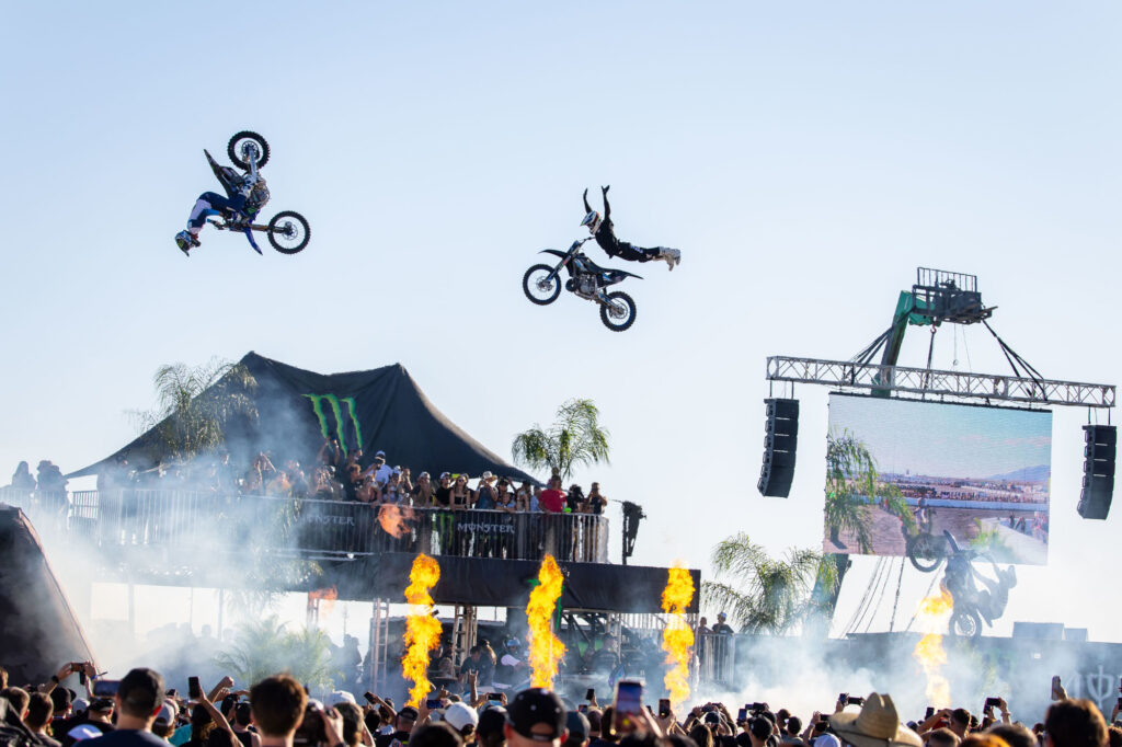 FMX riders perform in front of a crowd